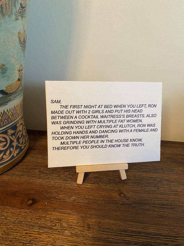 Framed canvas print of 'The Note' from Jersey Shore, featuring the Dear Sam anonymous letter, presented on a wood easel for elegant display.